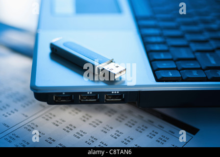 Studio shot of laptop with memory stick Stock Photo