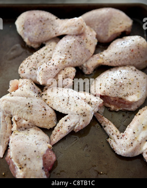 Close up of seasoned raw chicken pieces Stock Photo