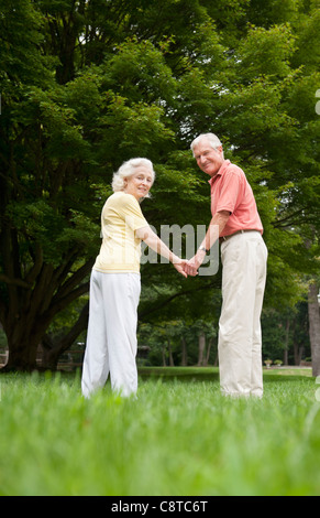 USA, New York State, Old Westbury, Senior couple standing in park Stock Photo