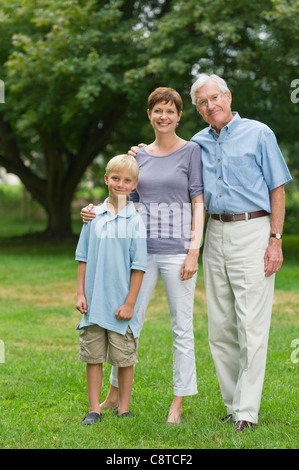 USA, New York State, Old Westbury, Three generation family standing in park Stock Photo