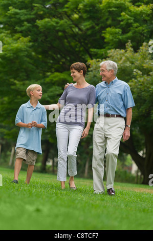 USA, New York State, Old Westbury, Three generation family walking in park Stock Photo