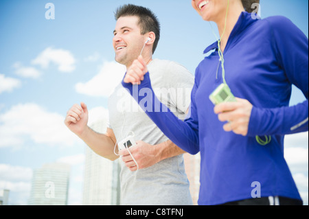 USA, New Jersey, Jersey City, Smiling couple jogging together Stock Photo