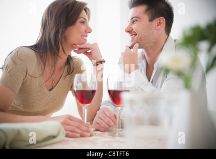 USA, New Jersey, Jersey City, Smiling couple drinking wine Stock Photo