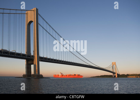 USA, New York State, New York City, Brooklyn, Container Ship under Verrazano-Narrows Bridge Stock Photo