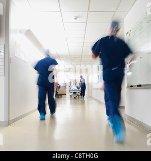 USA, Utah, Ogden, Medical team walking along hospital corridor before operation Stock Photo