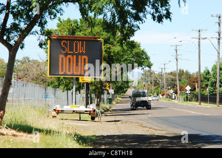 Slow Down sign after radar noted excess speed Stock Photo