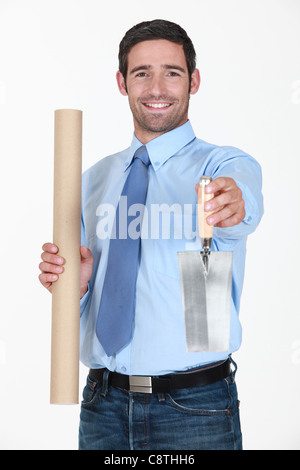 An architect handing a trowel. Stock Photo