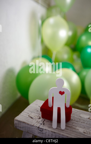 Heart With Human Representation And Balloon Stock Photo