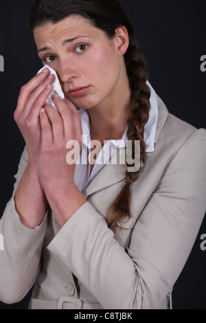 young woman shedding tears Stock Photo