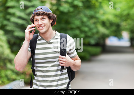 USA, Washington, Seattle, Male college student talking on cell phone Stock Photo