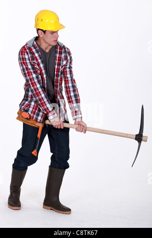 craftsman holding a pick Stock Photo
