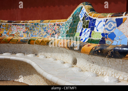 Fragment of a tiled bench with colorful mosaics in Park Guel. Barcelona, Catalonia, Spain.