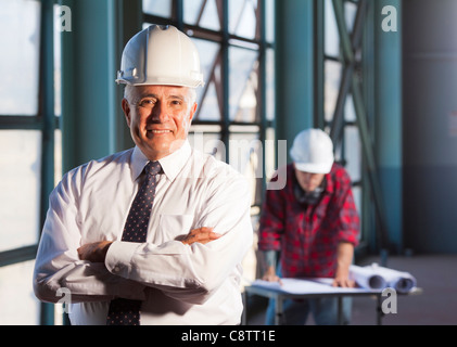 USA, New Mexico, Santa Fe, Portrait of man wearing tie and hardhat Stock Photo