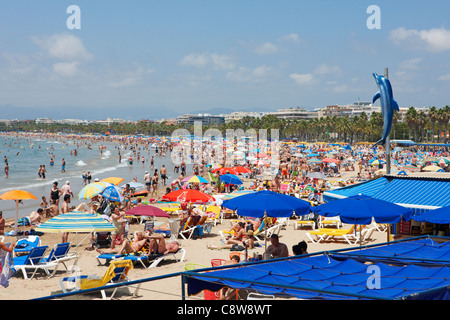 Elevated view of overcrowded Els Pilons Beach in Salou, Catalonia, Spain. Stock Photo