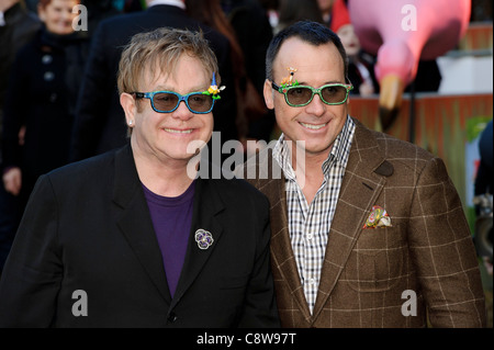Elton John (L) and David Furnish (R) attend the UK Premiere of Gnomeo and Juliet at a central London cinema. Stock Photo