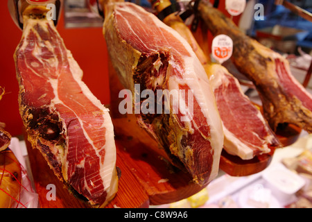 Jamon (Spanish ham) displayed in deli. Salou, Catalonia, Spain. Stock Photo