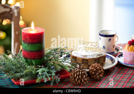 Decorative Cake And Lighted Candle Stock Photo