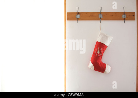 Christmas Stockings Hanging On Wooden Plate Stock Photo - Alamy