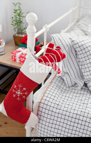 Teddy Bear In Christmas Stockings Hanging On Couch Handle Stock Photo