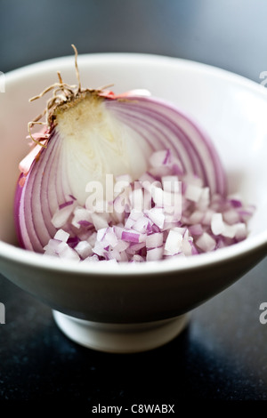 Chopped red onion in bowl Stock Photo