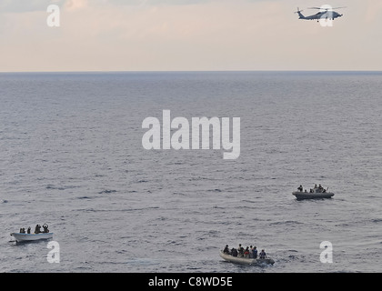 Visit, board, search and seizure team members (VBSS) in a rigid-hulled inflatable boat (RHIB) Stock Photo