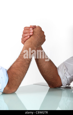 arm wrestling between males Stock Photo