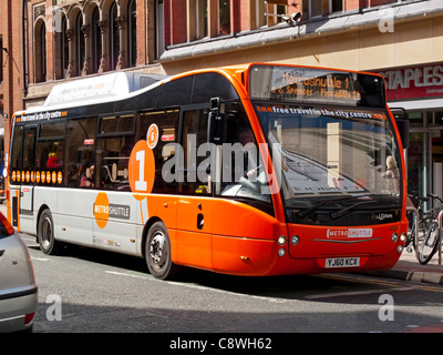 Metroshuttle free bus service in Manchester city centre England UK using an Optare electric hybrid vehicle