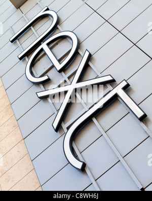 Sign outside branch of Next clothing store in Manchester England UK Stock Photo