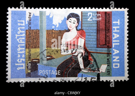 A postage stamp of Thailand painting in black background - international letter writing week Stock Photo