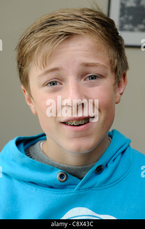 Close up of a 13 year old boy wearing braces. Stock Photo