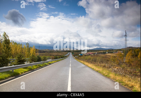 Endless highway under cloudy sky Stock Photo - Alamy