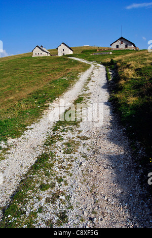 Typical Northern Italian Alps houses called Baita, made of wood and stone. In Trentino Stock Photo