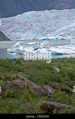 Tourists contemplating the Mendenhall glacier. Juneau. Alaska. USA Stock Photo