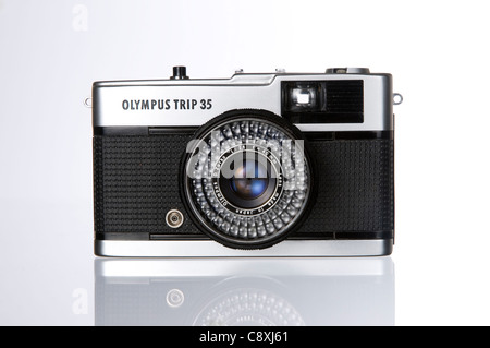 A 1970’s  Olympus Trip 35mm camera, photographing in a studio with white background. Stock Photo