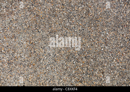 Lots of small pebbles on the wall. Stock Photo