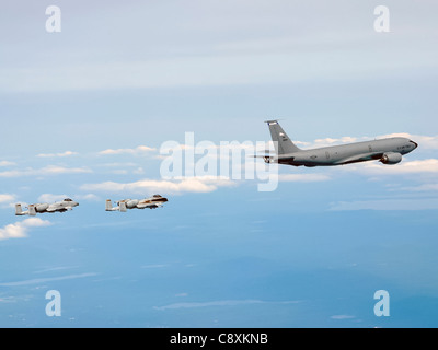 Two A-10 Thunderbolt IIs from the Connecticut Air National Guard's 103rd Fighter Wing fly in formation behind a KC-135 Stratotanker from the New Hampshire Air National Guard's 157th Air Refueling Wing during a special event held June 6 to promote Air Force Week New England which will take place in August. Stock Photo