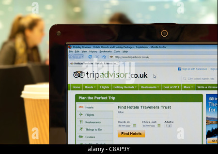 The Trip Advisor website shot in a coffee shop environment (Editorial use only: print, TV, e-book and editorial website). Stock Photo