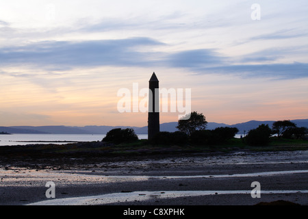 Sunset over the Pencil Monument in the seaside town of Largs on the Firth of Clyde, Ayrshire, Scotland, UK Stock Photo