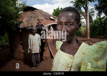 Survivors of powerful hailstorms stand in the rubble of their home in Namutumba District, Uganda, East Africa.
