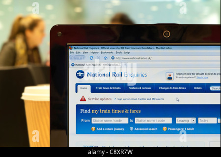 The National Rail website shot in a coffee shop environment (Editorial use only: print, TV, e-book and editorial website). Stock Photo