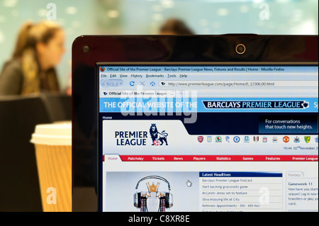 The Premier League website shot in a coffee shop environment (Editorial use only: print, TV, e-book and editorial website). Stock Photo