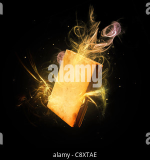 Closed magic book amazing colorful light rays and streaks. Stock Photo