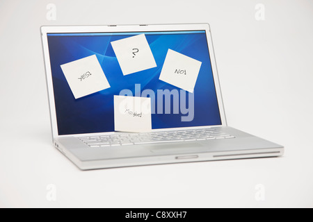 Studio shot of laptop with adhesive notes on screen Stock Photo