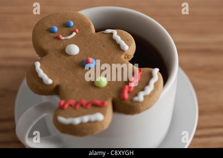 USA, Illinois, Metamora, Close up of  coffee cup and gingerbread man Stock Photo