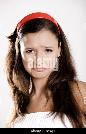 Portrait of a beautiful young woman crying, isolated on white Stock Photo