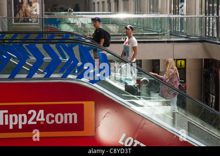 people in airport on indoor escalator Palma de mallorca Spain Europe Stock Photo