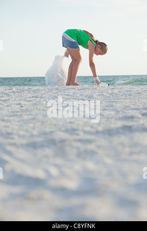 USA, Florida, St. Petersburg, girl (12-13) floating on water in pool