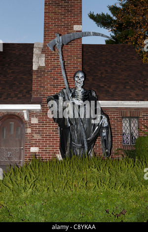 Grim Reaper in front of a house. Stock Photo