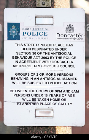 Antisocial behaviour warning notice posted on a lamp post in Thorne. Stock Photo