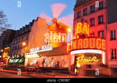 Moulin Rouge in Paris at night Stock Photo